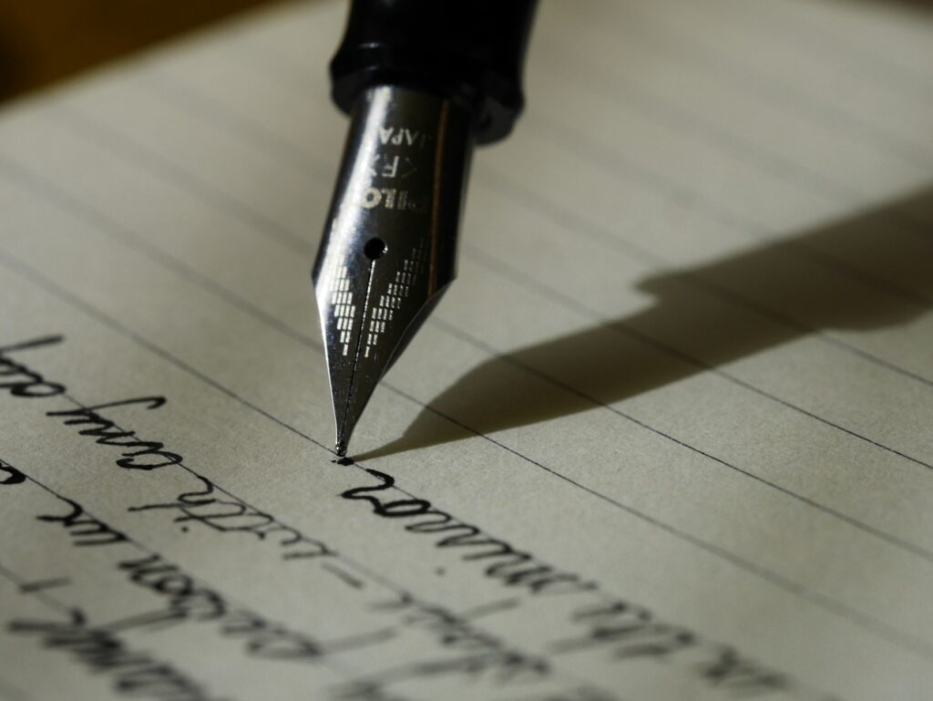 Author writing desk with notebook and writing tools